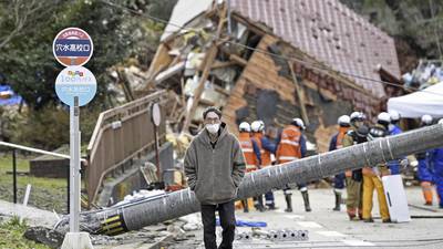 Survivors are found in homes smashed by Japan quake that killed 94 people. Dozens are still missing
