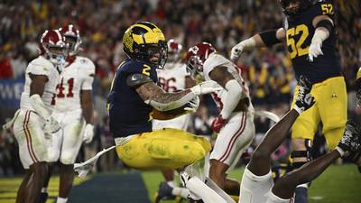 No. 1 Michigan beats No. 4 Alabama 27-20 in overtime on Blake Corum’s TD run to reach the CFP national title game