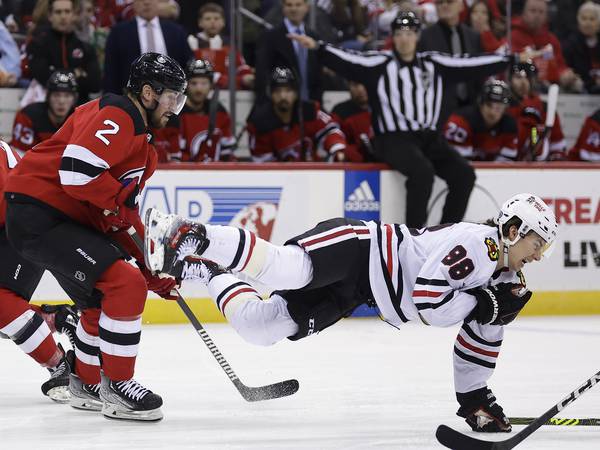 Connor Bedard exits with an injury early in the Chicago Blackhawks-New Jersey Devils game