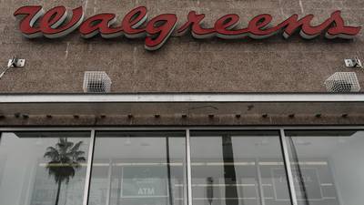 Drugstore chain Walgreens cuts quarterly dividend to get more cash to grow its business