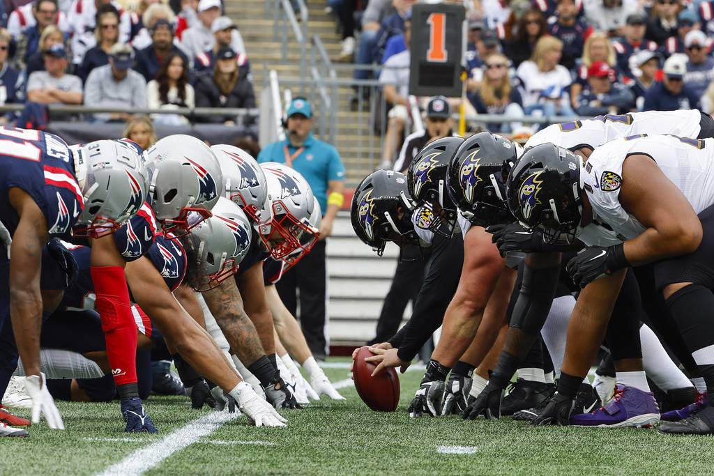 The New England Patriots and the Baltimore Ravens line up at the line of scrimmage for the snap during an NFL football game at Gillette Stadium, Sunday, Sunday, Sept. 24, 2022 in Foxborough, Mass.